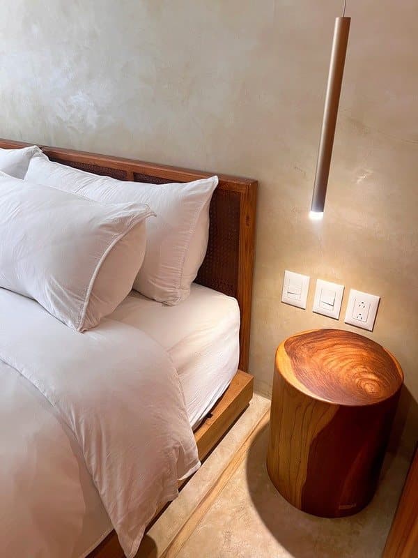 Crisp linen and warm wood in every room.