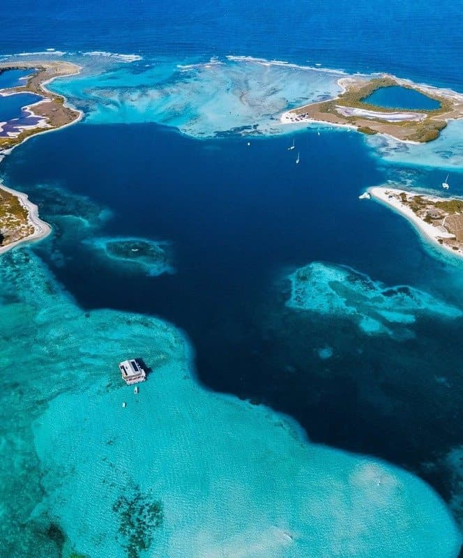 Reefs and lagoons around the nearby cays.
