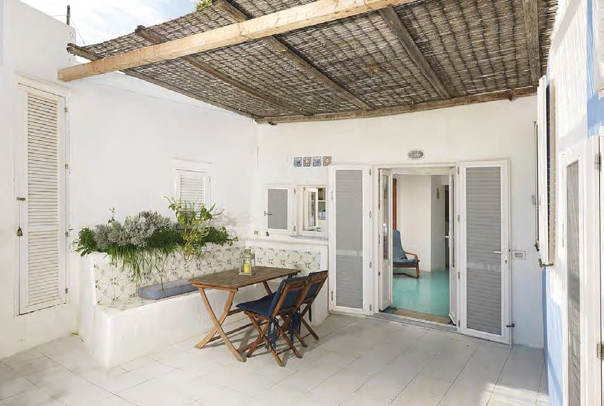 The guest house terrace, with its own pergola and table.