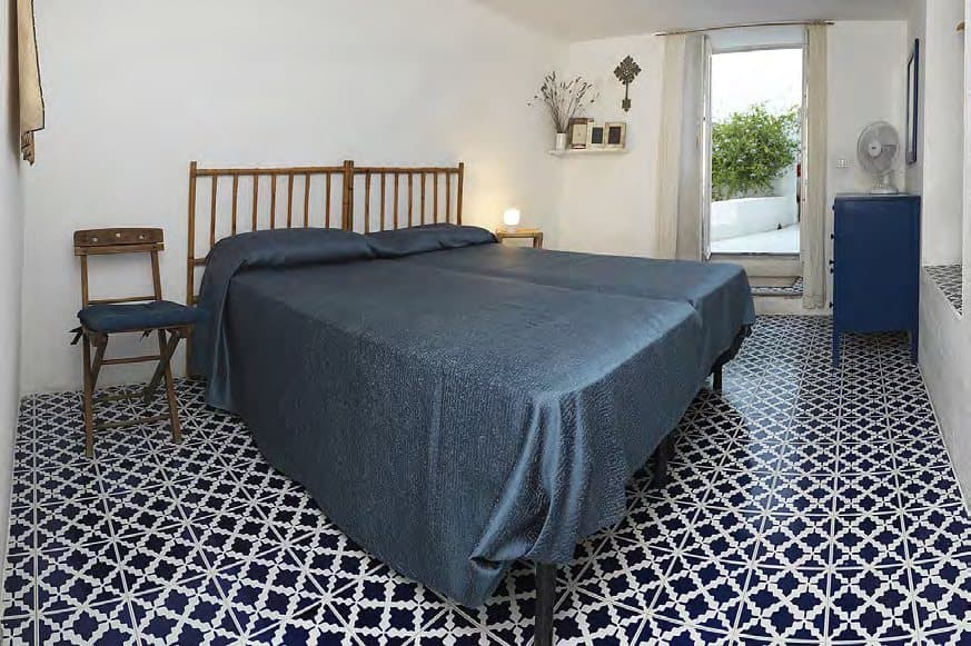 Majolica floors and island blues in the second guest bedroom.