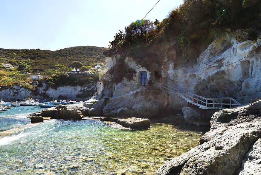 Rocky coves and clear water near Cala Feola.