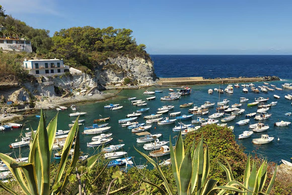 Boats moored in a sheltered bay of the island.