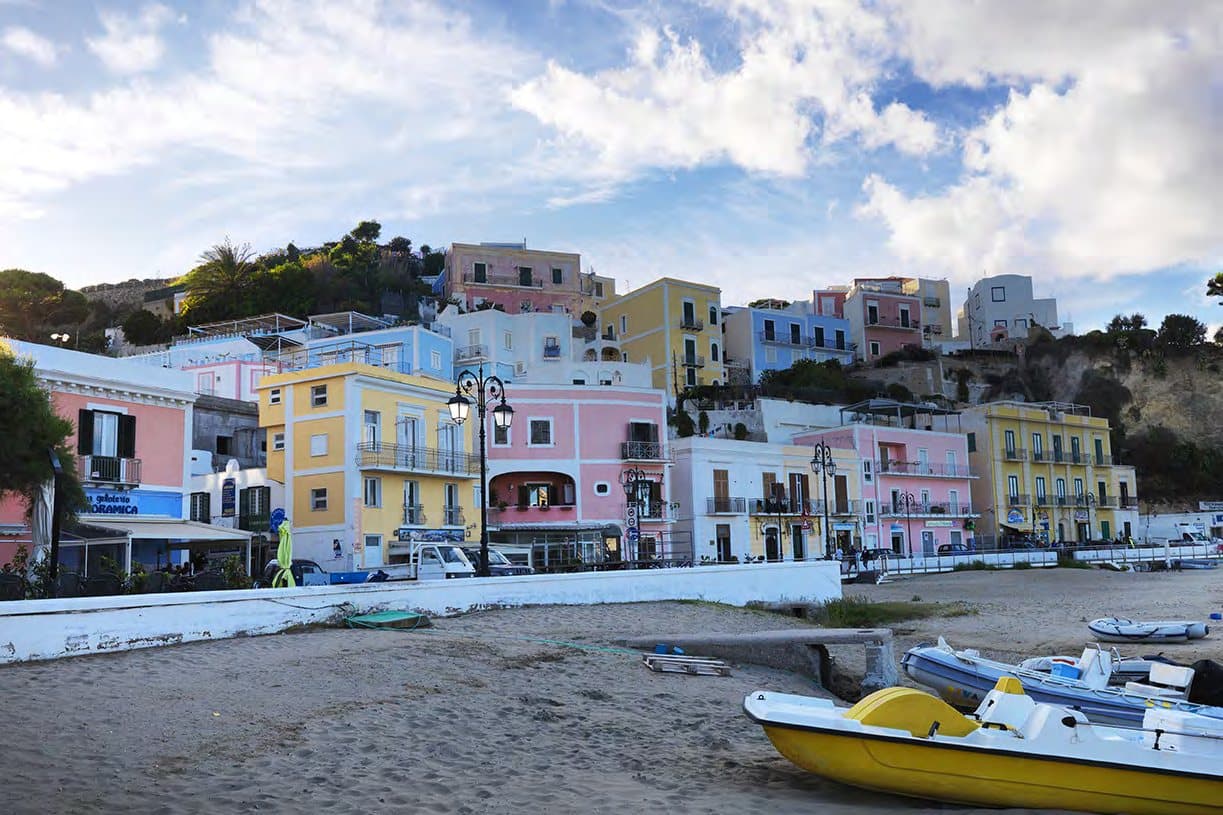 The pastel waterfront of Ponza port.