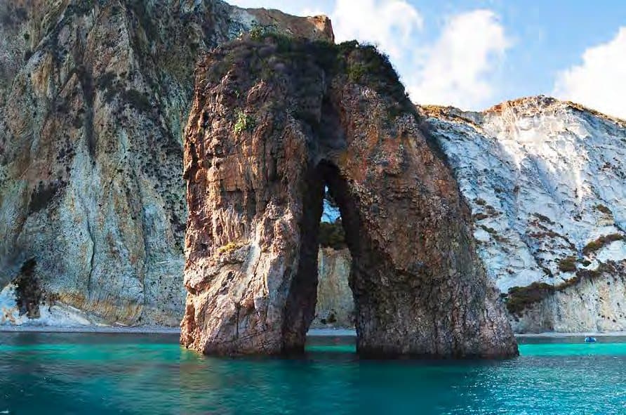 Sea arches and turquoise water: Ponza by boat.