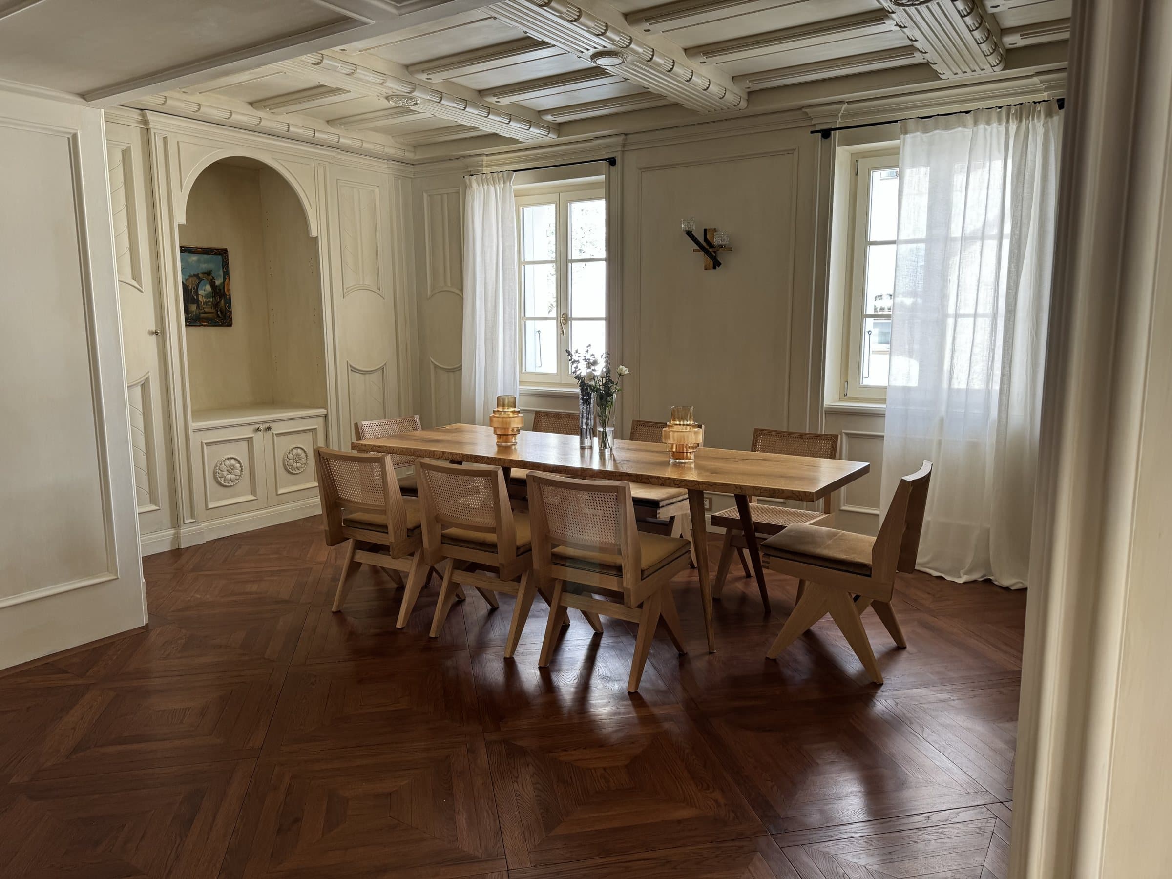 The dining room, set for a long table of family and friends.