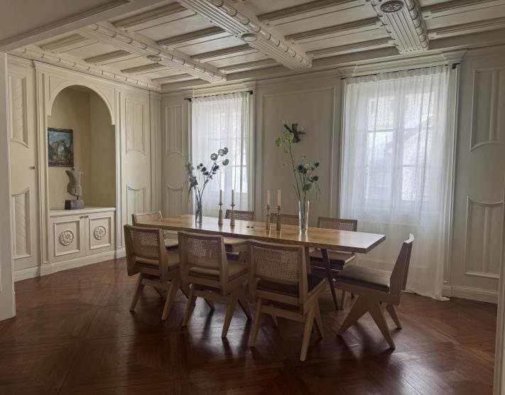 Light from both sides falls across the dining room.